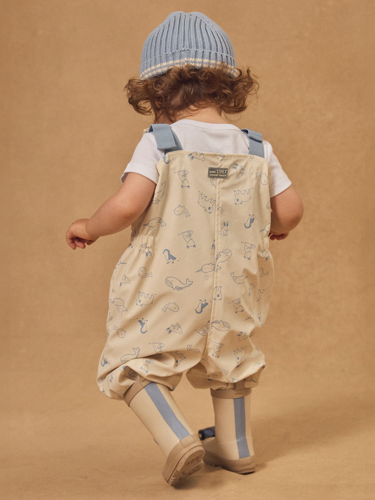 Salopette da pioggia ecru con stampa animale per neonato maschio - Image 4